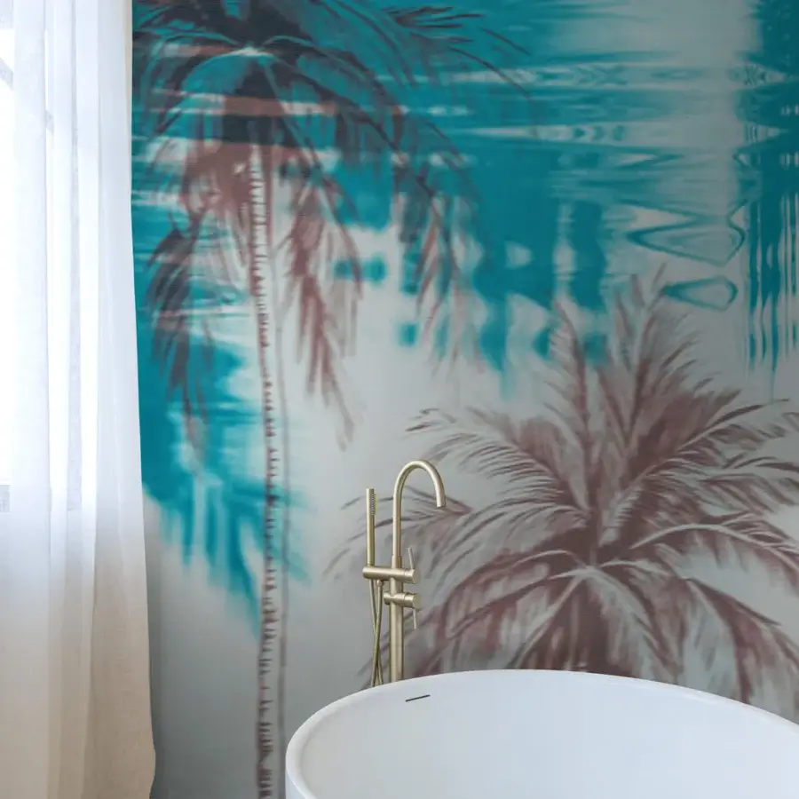 Superior Wall&Decò De Focus wallpaper displaying blurred palm trees and rippling water in teal and muted rose with a satin finish