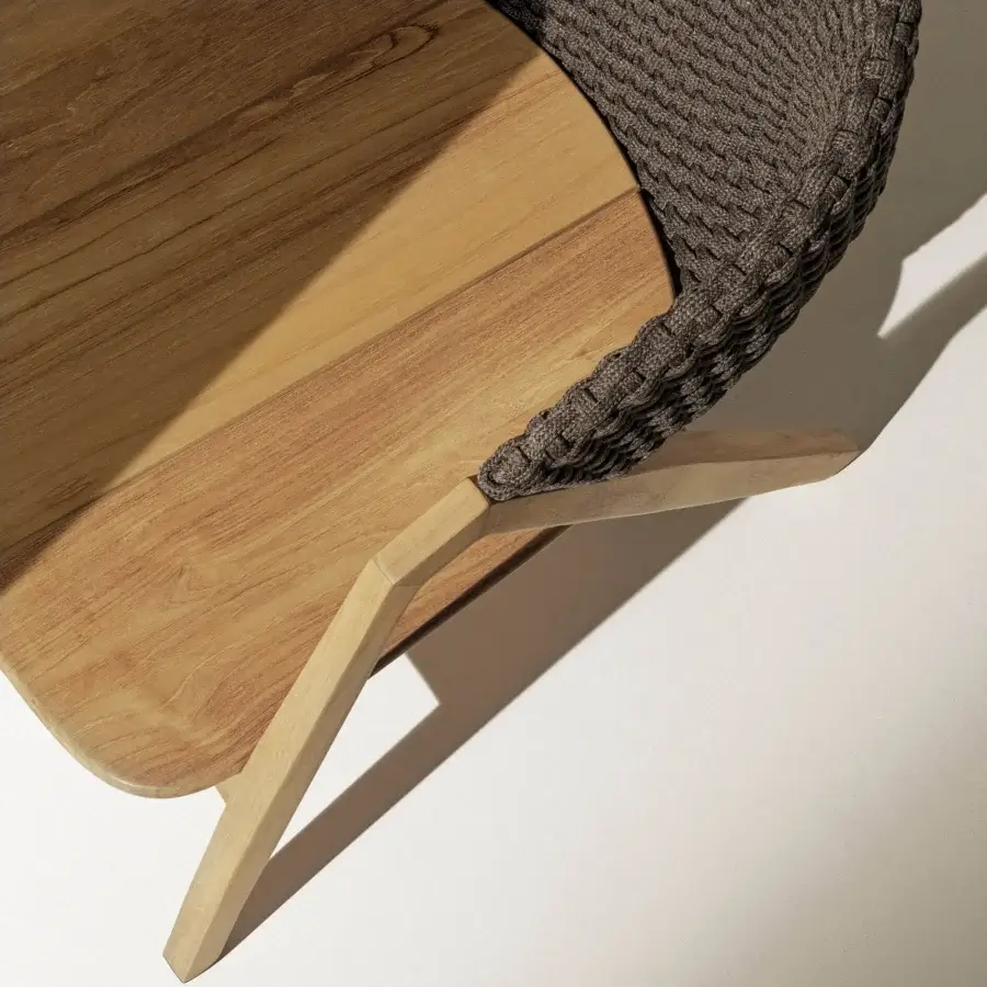 Elegant Ethimo Knit lounge chair with dark gray woven rope backrest and teak wood frame