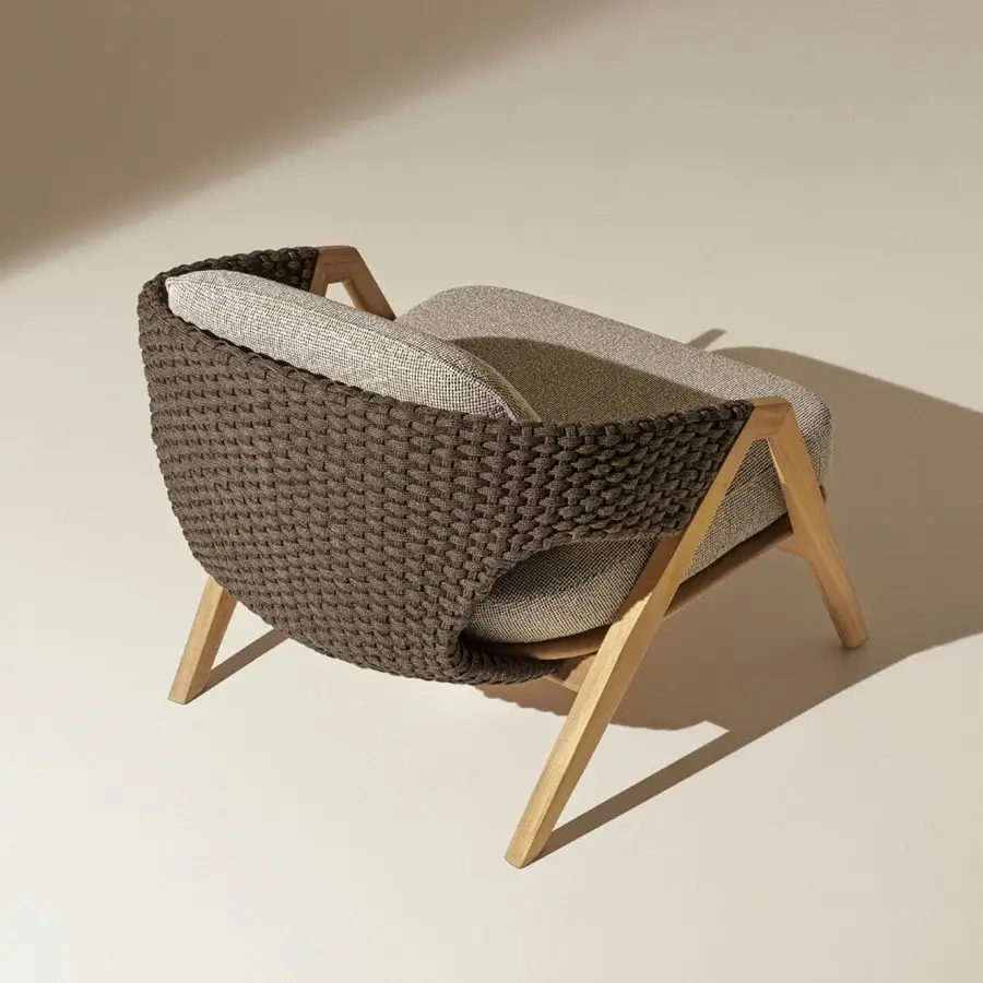 Exceptional Ethimo Knit lounge chair crafted with teak and a woven brown rope backrest with beige interior panels