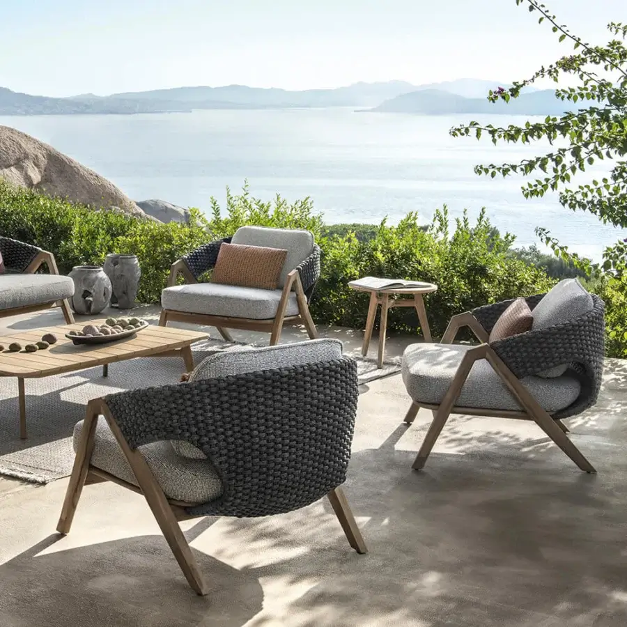 Distinguished Ethimo Knit lounge chair with a teak wood frame and sophisticated woven rope backrest in dark gray with a satin finish