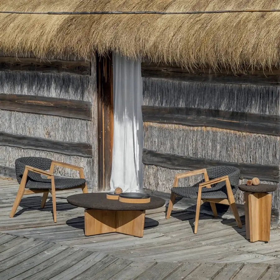 Distinguished Ethimo Knit lounge chair with a dark gray high-density woven rope and solid FSC-certified teak frame