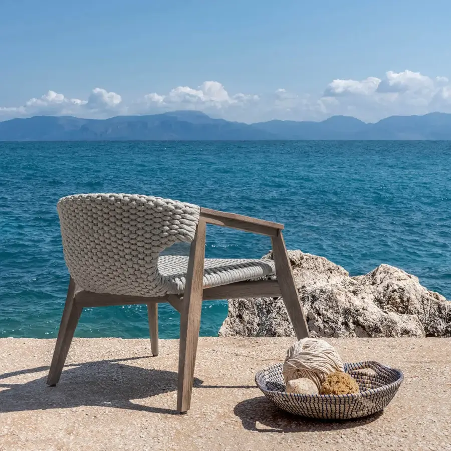 Refined Ethimo Knit lounge chair with sinuous FSC-certified teak and light beige high-density woven rope construction