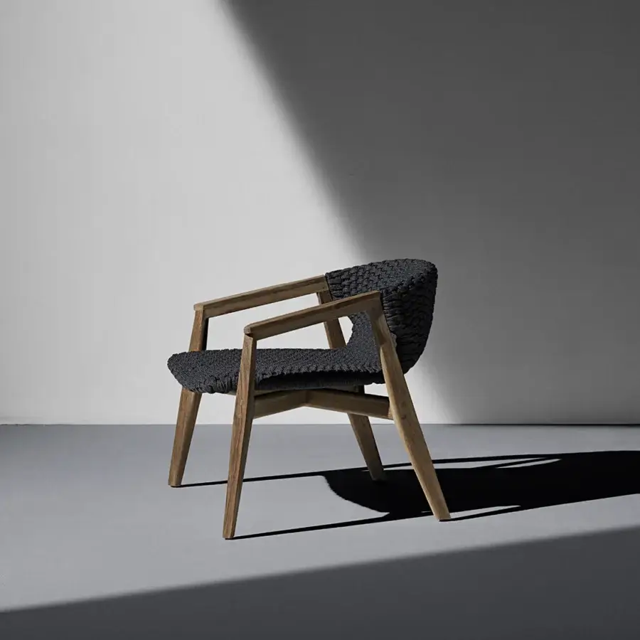 Exceptional Ethimo Knit lounge chair with a sinuous FSC-certified teak frame and dark gray woven rope seat