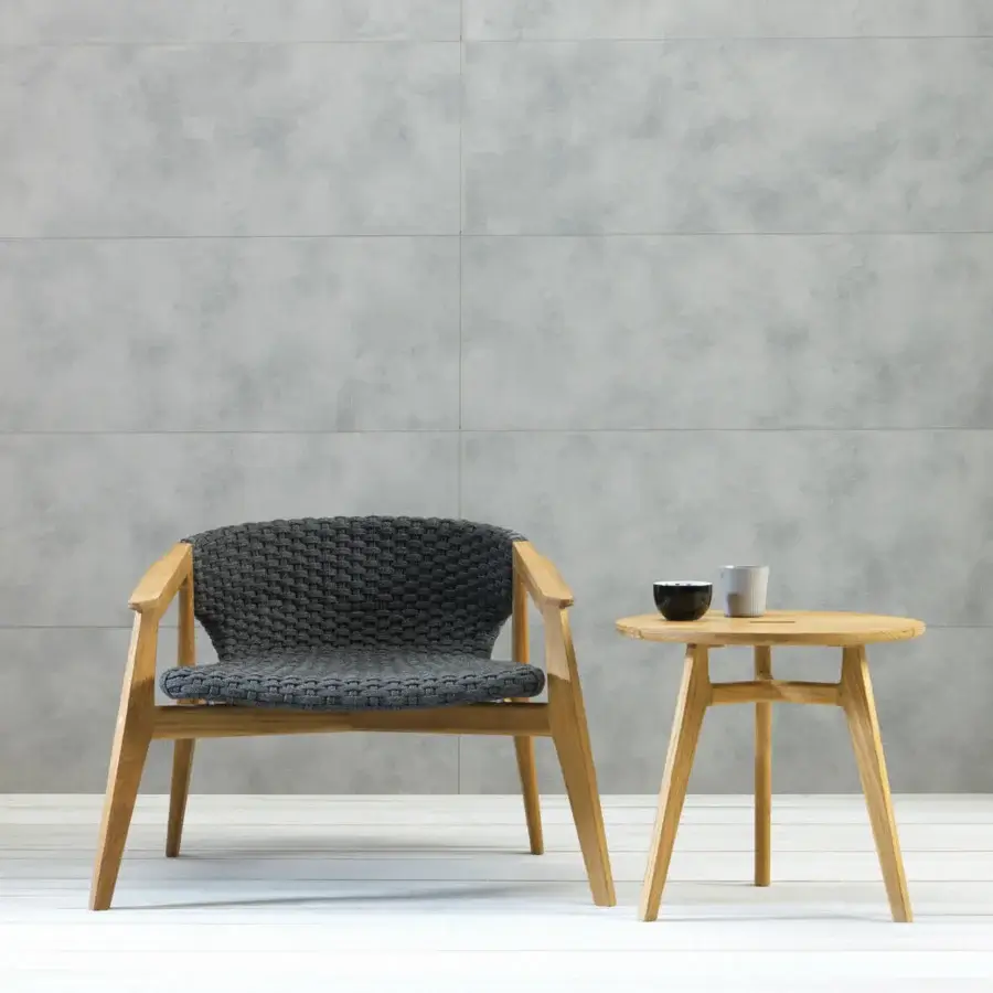 Exceptional Ethimo Knit lounge chair crafted with a sinuous FSC-certified teak frame and dark gray woven rope in a satin finish