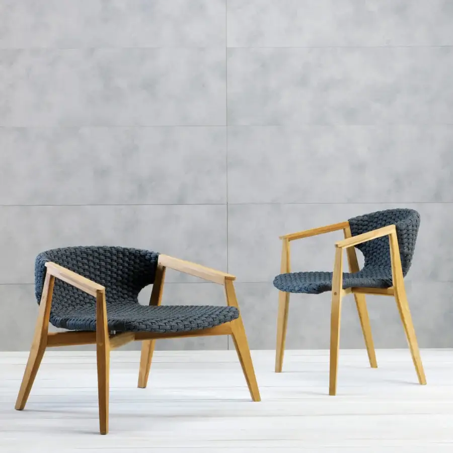 Distinguished Ethimo Knit lounge chair with sinuous FSC-certified teak frame and dark navy woven rope seat