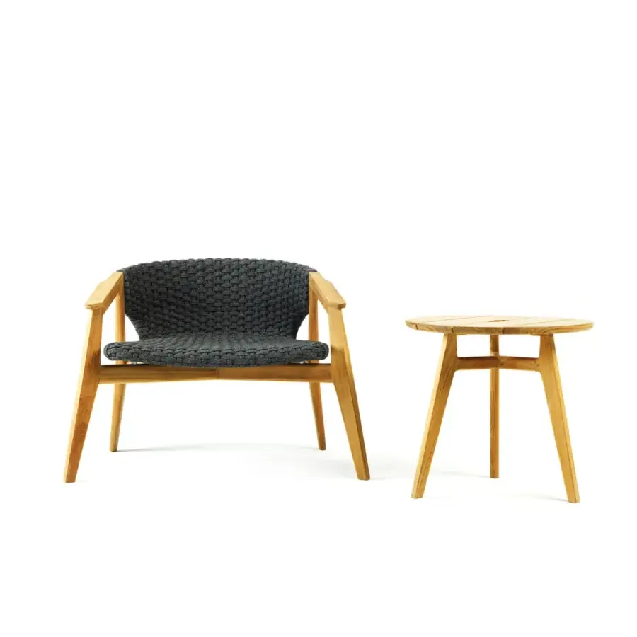 Refined Ethimo Knit lounge chair with a sinuous FSC-certified teak frame and dark gray high-density woven rope seat