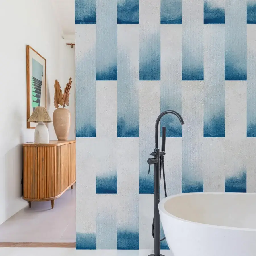 Innovative Wall&Decò Onde wallpaper in indigo and sky blue hues with a soft, cloud-like texture and subtle wave-inspired movement
