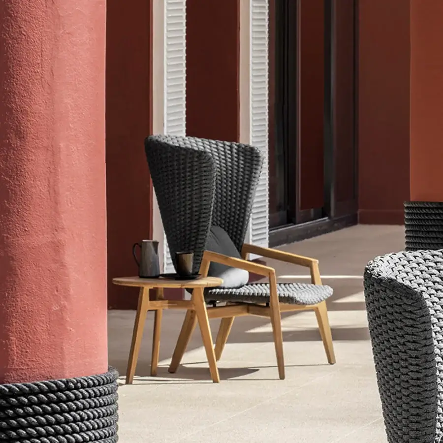 Exceptional Ethimo Knit side table crafted in FSC-certified teak with a satin finish and angled legs
