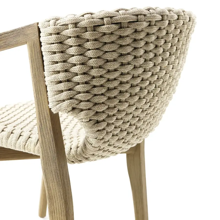 Exceptional Ethimo Knit armchair with a sinuous hand-finished FSC-certified teak frame and woven neutral beige rope backrest