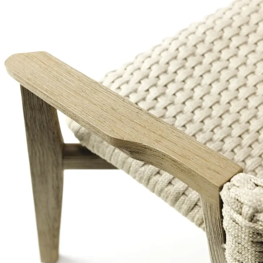 Sophisticated Ethimo Knit armchair with woven rope and a sinuous hand-finished FSC-certified teak frame in neutral beige