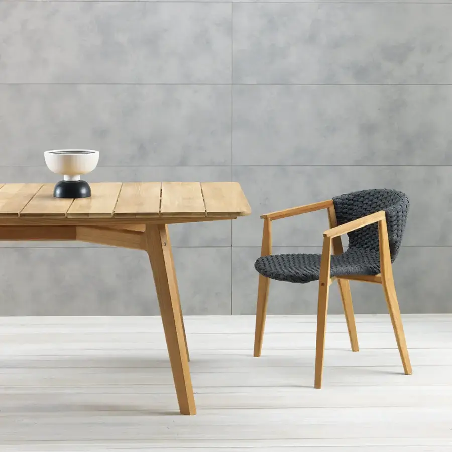 Exceptional Ethimo Knit armchair with dark gray woven textile and hand-finished medium-brown FSC-certified teak frame