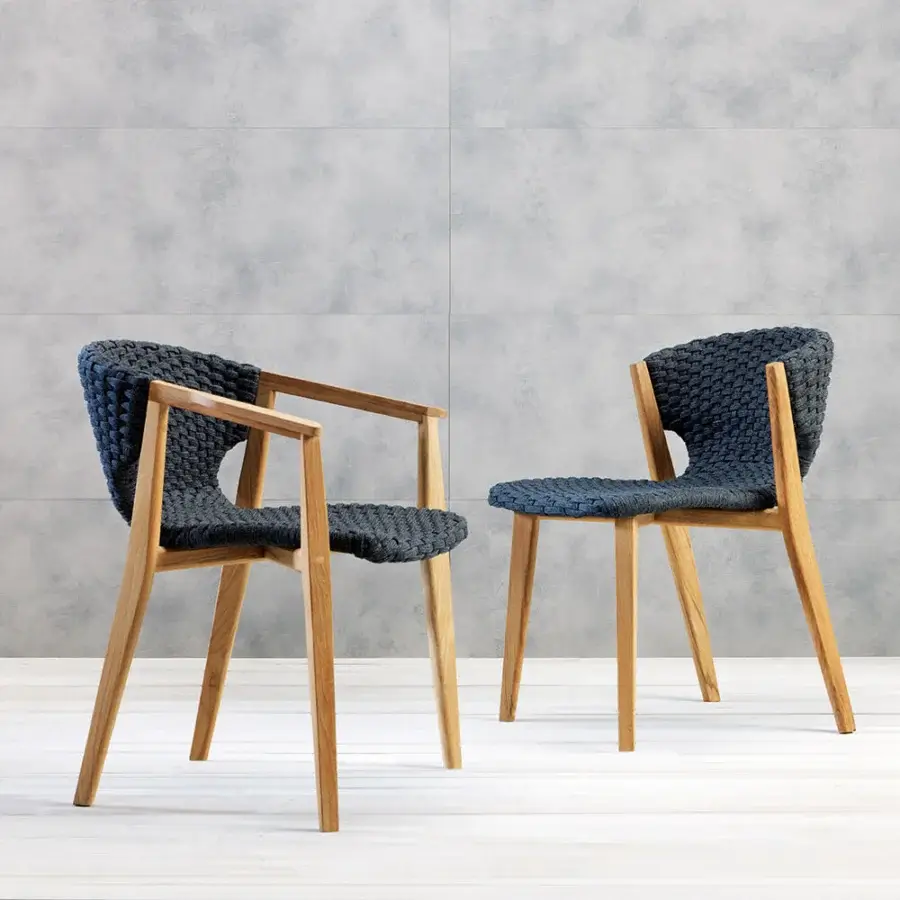 Distinguished Ethimo Knit armchair with a sinuous hand-finished FSC-certified teak frame and dark gray-blue woven rope backrest
