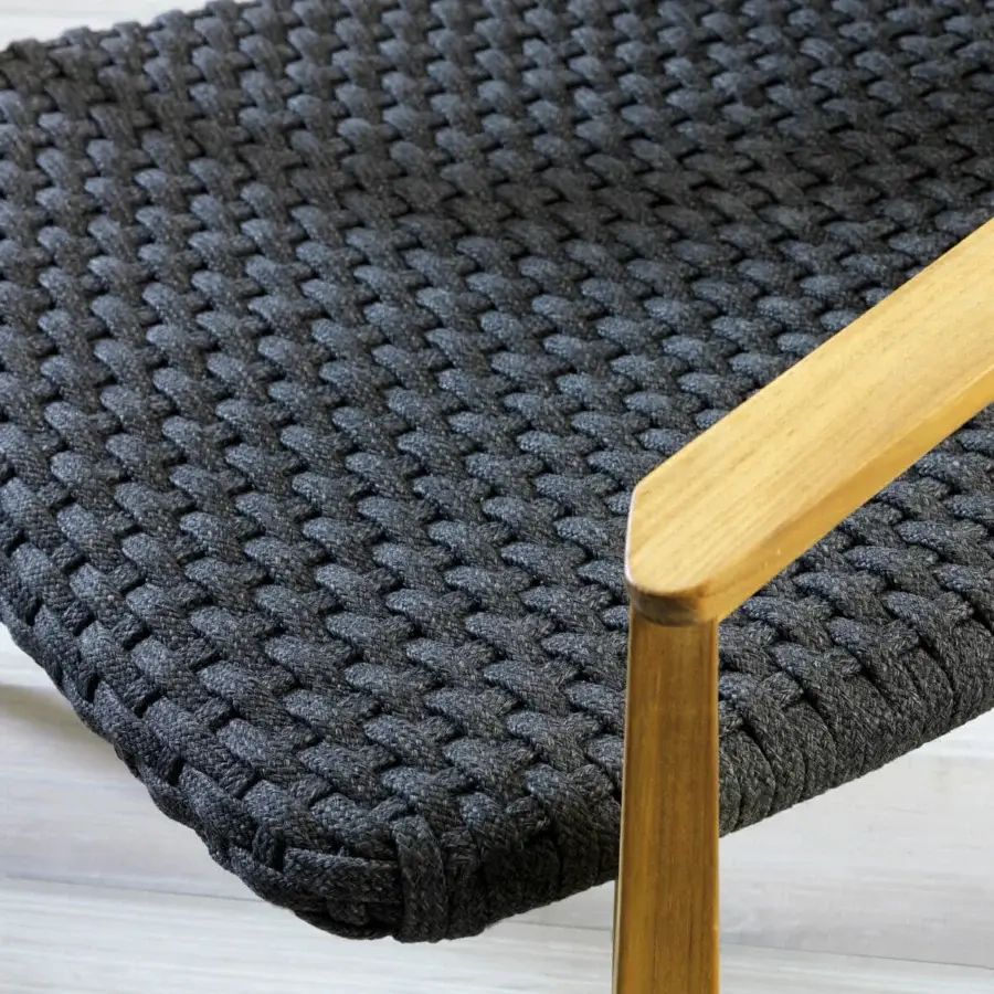 Lavish Ethimo Knit armchair with deeply charcoal woven seat and backrest in a sinuous hand-finished FSC-certified teak frame