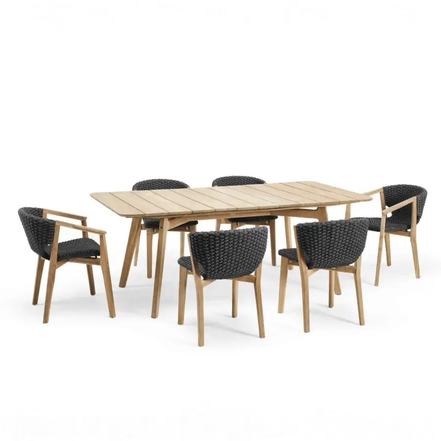 Captivating Ethimo Knit armchair with a dark gray woven textile and sinuous hand-finished FSC-certified teak frame