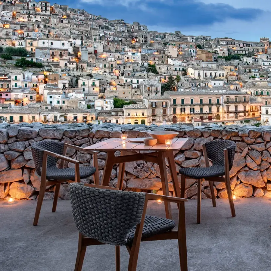 Exceptional Ethimo Knit table crafted in medium-toned brown teak with a smooth satin finish for outdoor settings