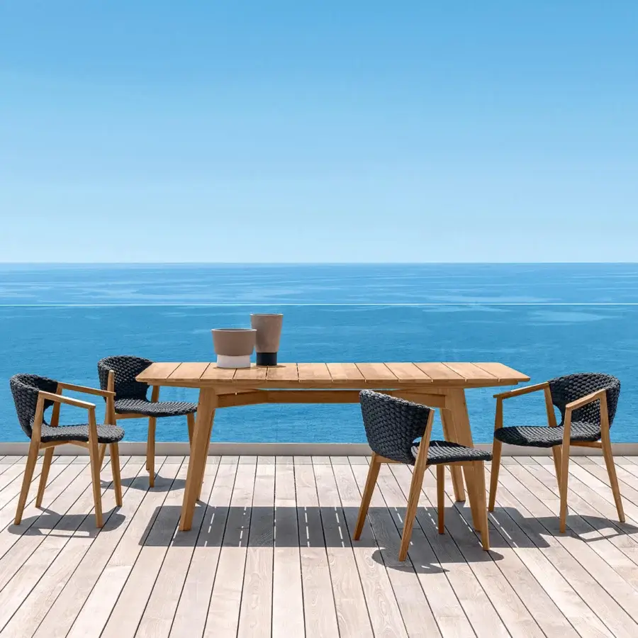 Distinguished Ethimo Knit table crafted in medium-toned brown FSC-certified teak with a smooth satin finish