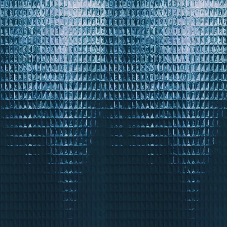 Distinguished Wall&Decò Skin wallpaper presents a sleek geometric pattern in deep teal with silvery-blue highlights and a three-dimensional surface