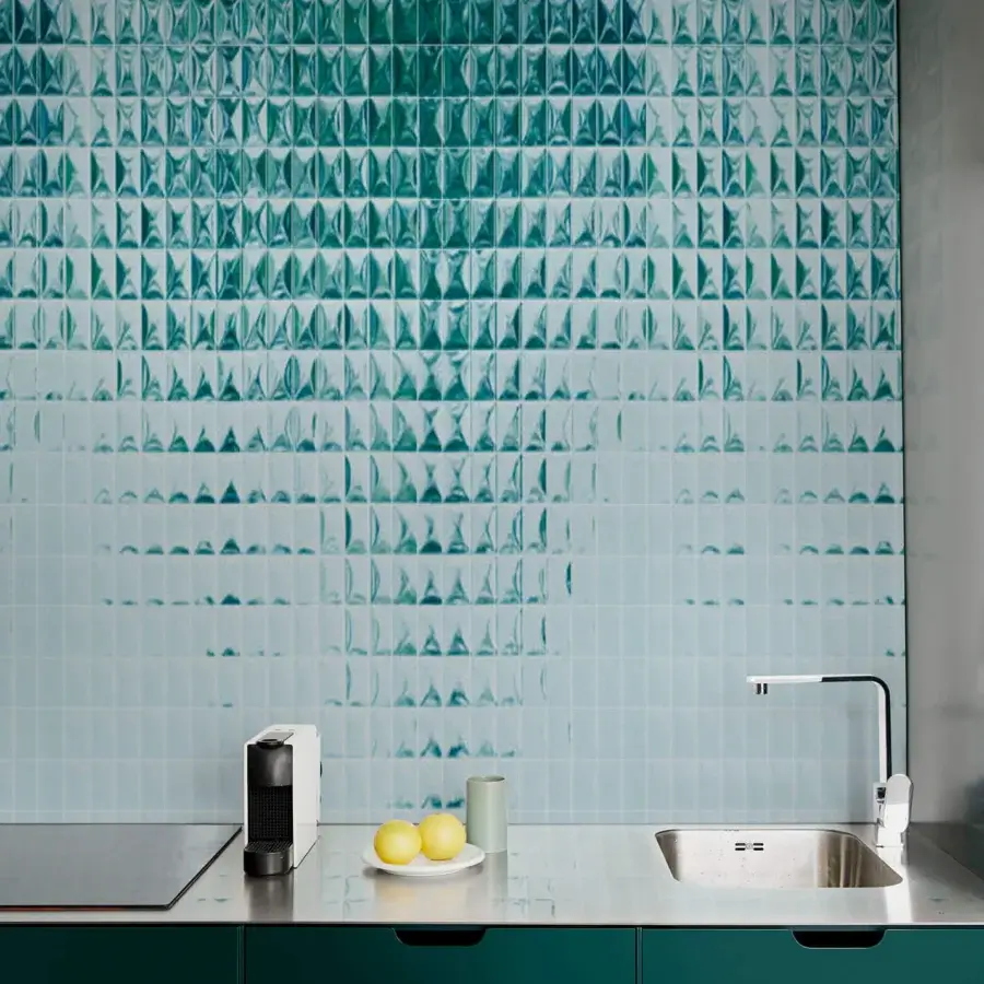 Exceptional Wall&Decò Skin wallpaper delivers a sleek three-dimensional surface with a gradient of teal and light blue water-based resins
