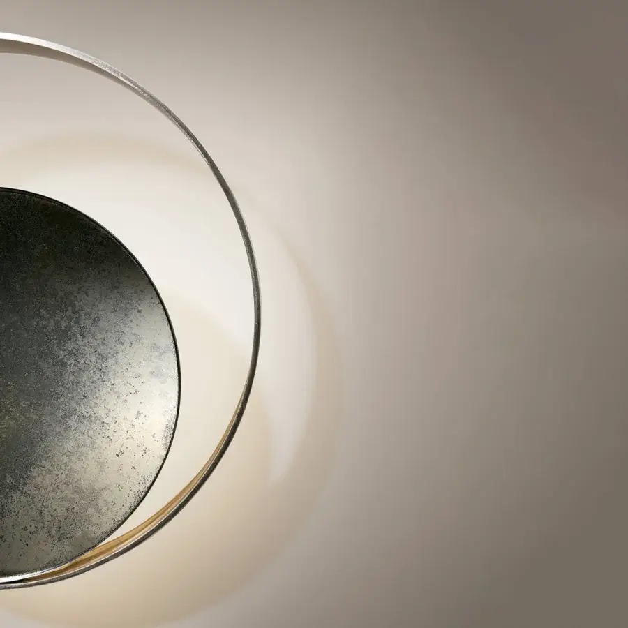 Captivating VENICEM Circle Wall Lamp crafted in burnished brass and matte black nickel with indirect illumination
