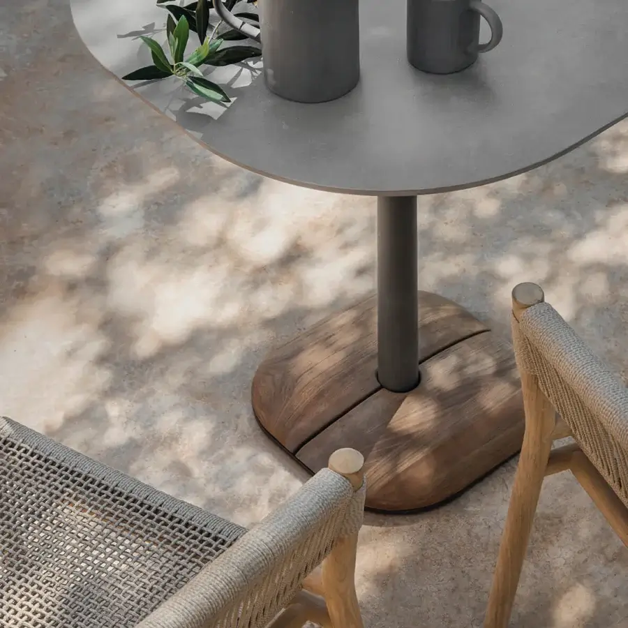 Distinguished Ethimo Enjoy Bistrot table with a matte grey tabletop and natural teak base cover crafted in Italy
