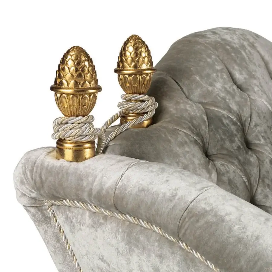 Lavish Zanaboni Lara lounge chair built with muted gray textile and gilded metal detailing
