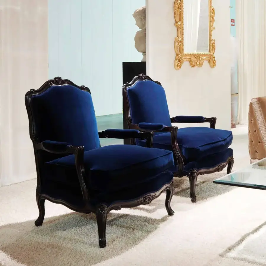 Distinguished Zanaboni Luigi XV lounge chair with deep blue textile upholstery and intricately carved solid wood construction crafted by hand