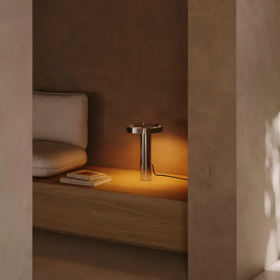 Distinguished VENICEM Circle Table Lamp with metal crafted in a polished pewter finish diffusing a warm golden light