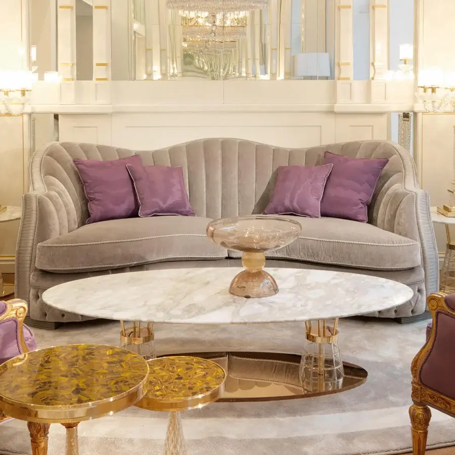 Superior Zanaboni Smeraldo sofa upholstered in textured matte fabric with soft lavender cushions and refined gold finish