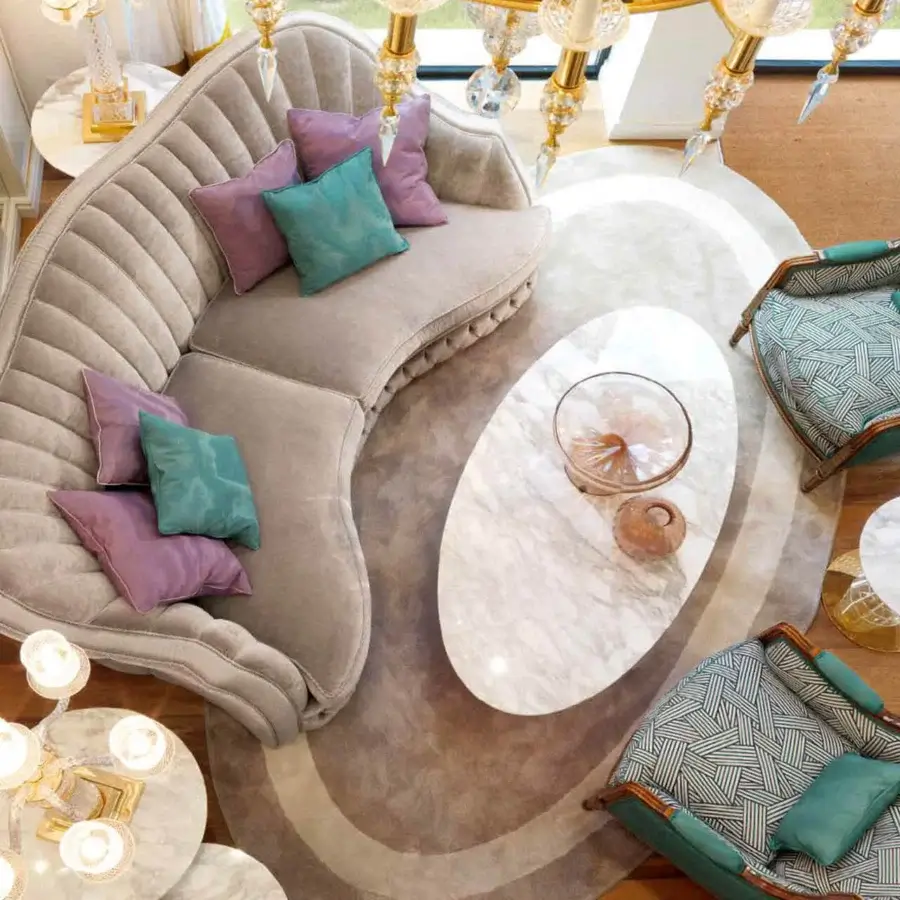 Elegant Zanaboni Smeraldo sofa upholstered in subtly textured beige fabric with lavender and teal cushions offering quilted detailing