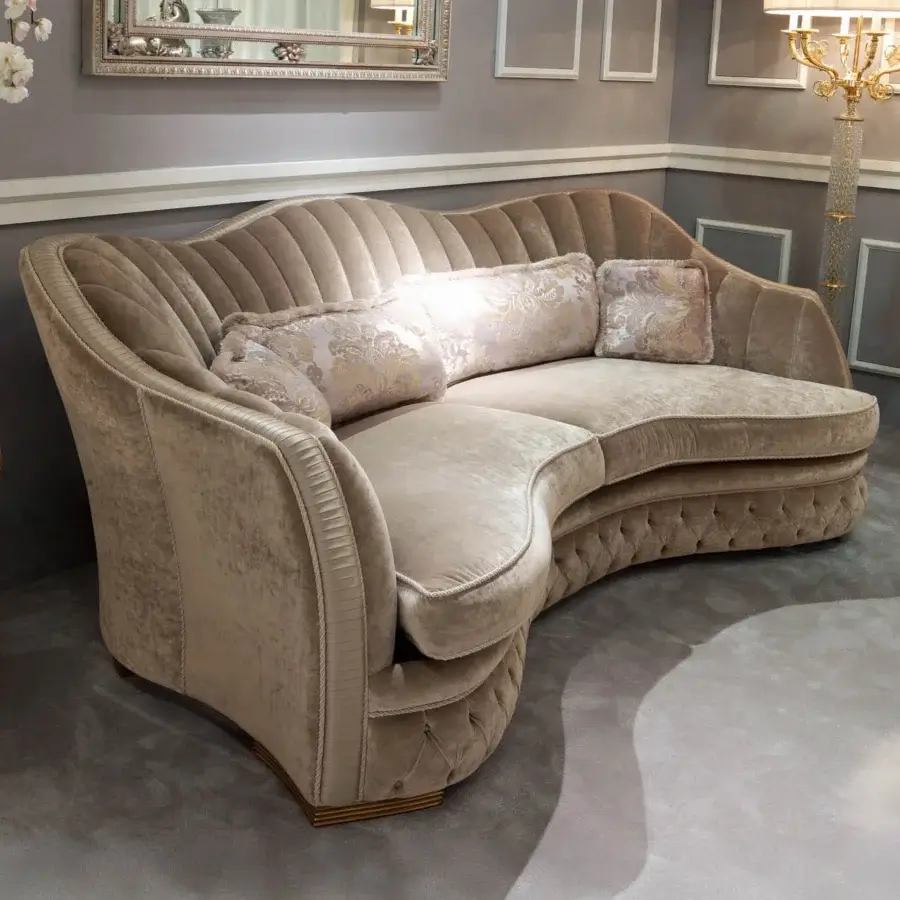 Lavish Zanaboni Smeraldo sofa built with textured satin fabric exhibiting muted beige and pale gold hues with detailed tufting