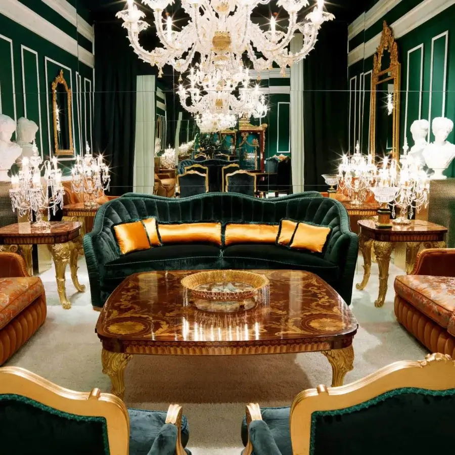 Distinguished Zanaboni Smeraldo sofa built in textured emerald green fabric with patterned orange, gold, and brown cushions and glossy legs