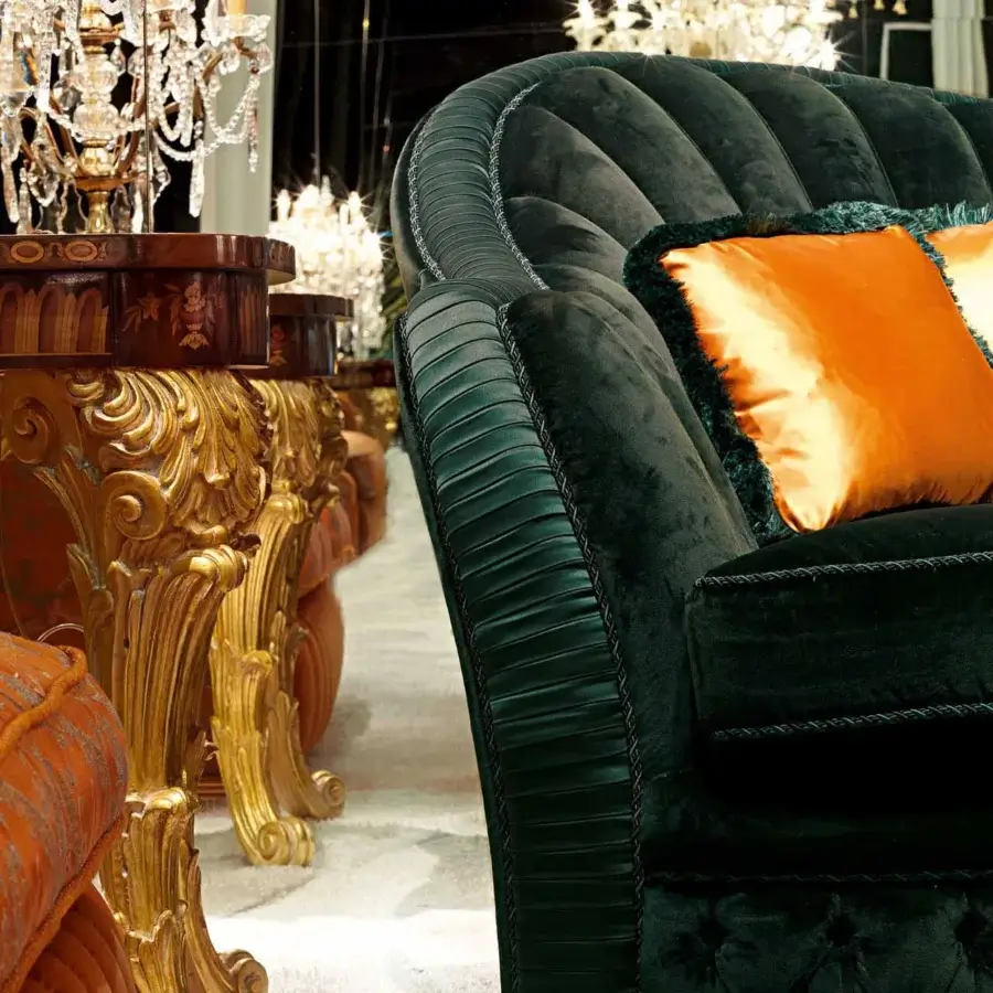 Superior Zanaboni Smeraldo sofa built in plush deep teal velvet with vibrant orange cushions and decorative cord detailing