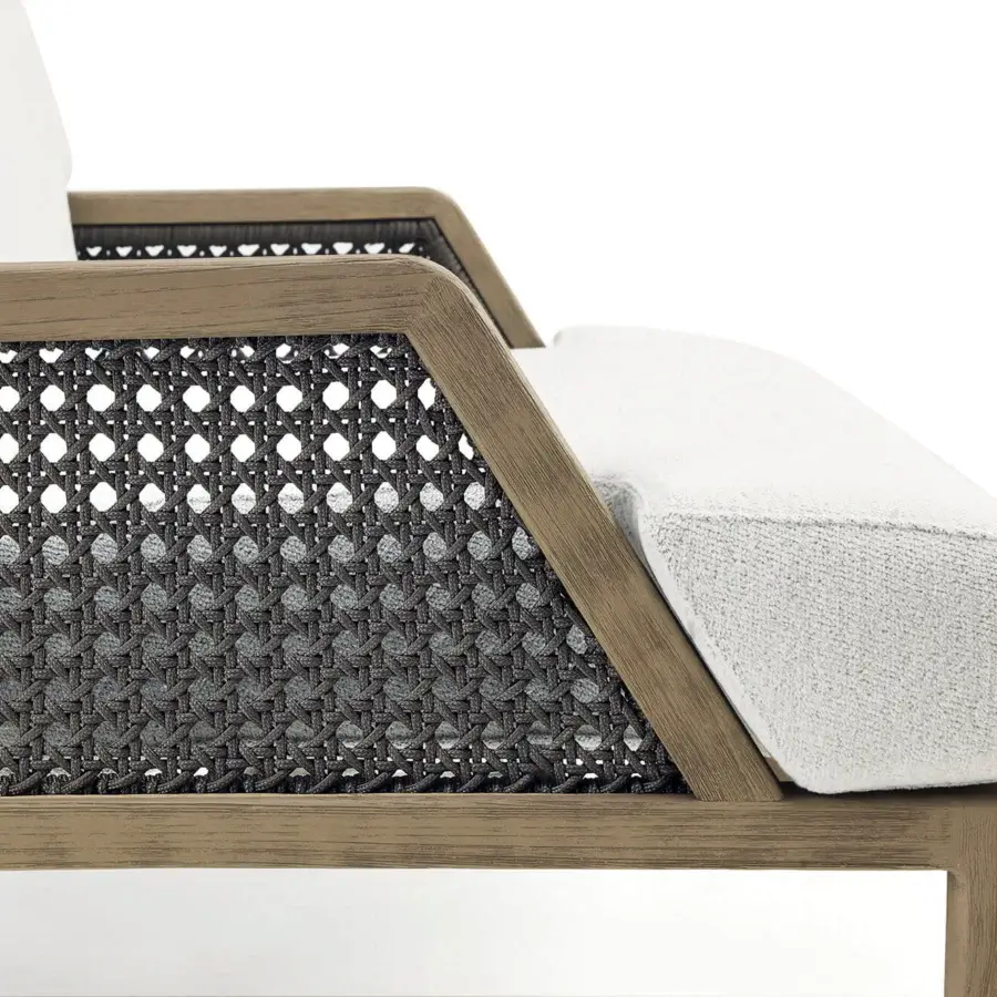 Exceptional Ethimo Grand Life lounge chair crafted with warm wood and a refined dark gray woven seat with soft white textile cushioning