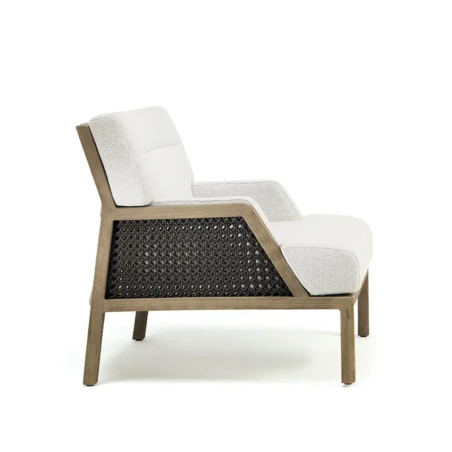 Sophisticated Ethimo Grand Life lounge chair crafted with warm wood and dark woven synthetic paneling in textured off-white textile
