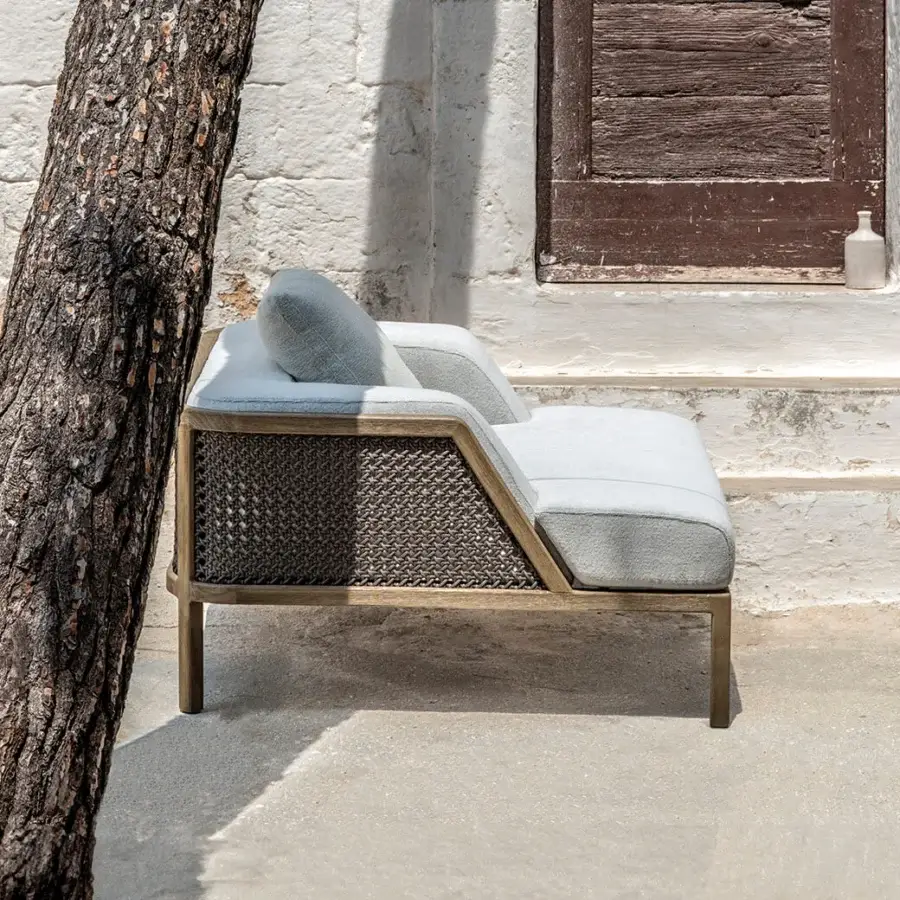 Exceptional Ethimo Grand Life lounge chair with a warm wooden frame and muted gray-blue textile weave in a satin finish