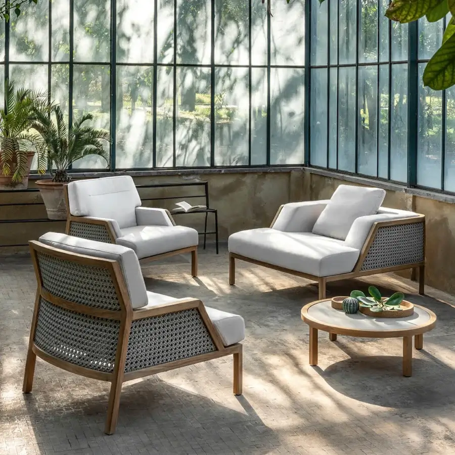Lavish Ethimo Grand Life lounge chair with woven synthetic panels and satin-finish wooden frame for prestigious outdoor settings