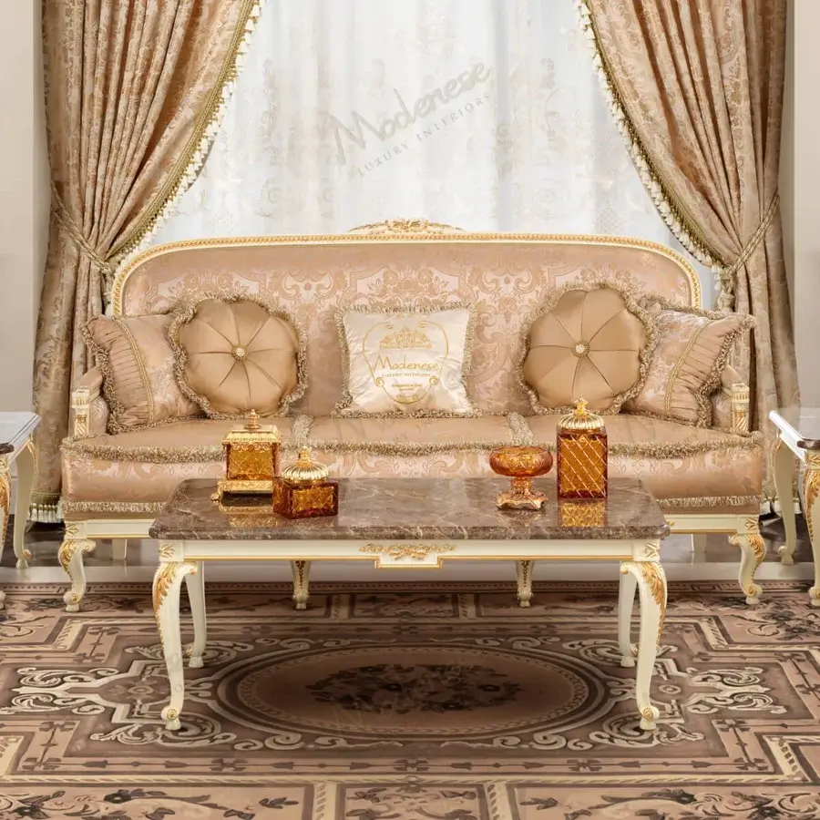 Exquisite Modenese Midnight Moon coffee table built with marble and gold accented, cream carved legs