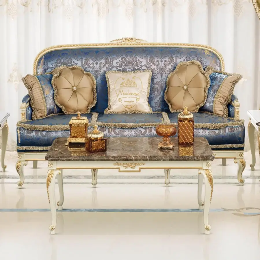 Superior Modenese Midnight Moon coffee table with dark gray marble and intricately carved creamy white legs accented with gold finish