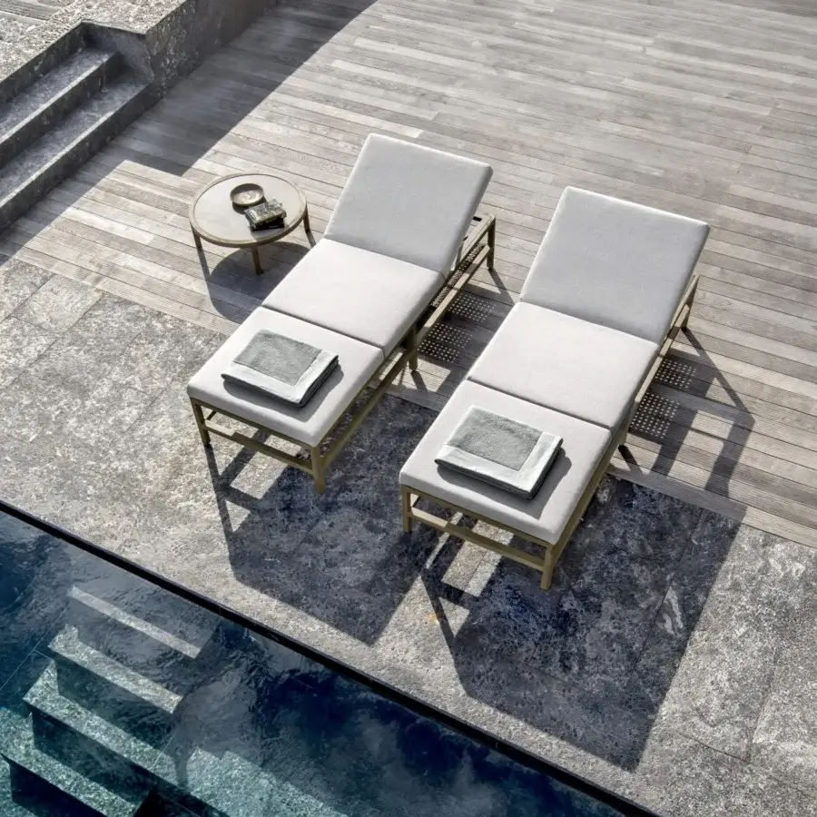 Distinguished Ethimo Grand Life lounger with light gray woven cushions and matte golden metal frame crafted in Italy