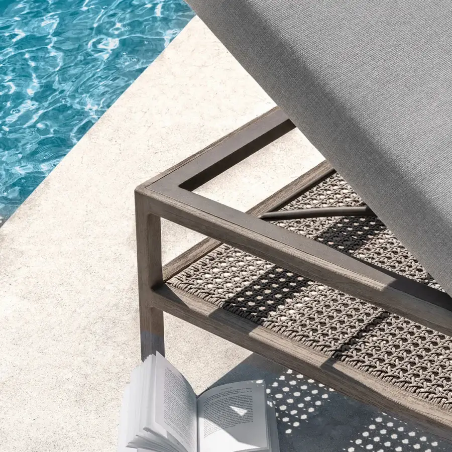 Exceptional Ethimo Grand Life lounger with woven synthetic seat and medium-brown wood frame featuring a satin finish