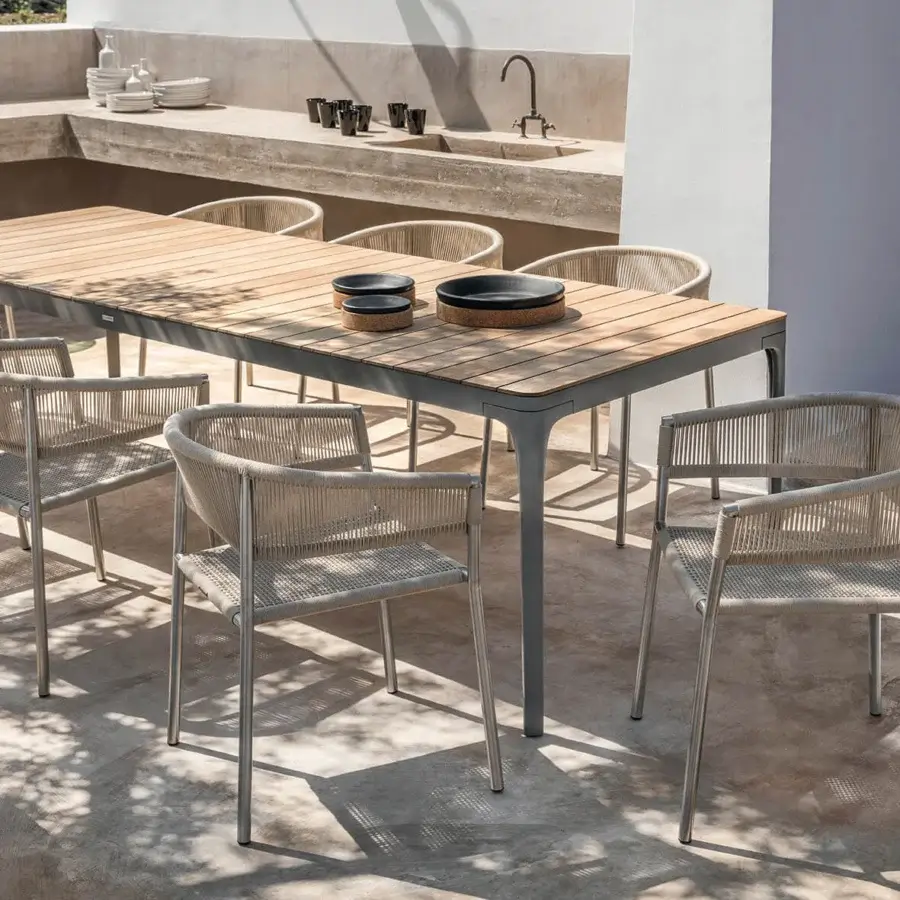 Distinguished Ethimo Play table crafted in wood with a smooth satin finish and a light gray matte metal frame