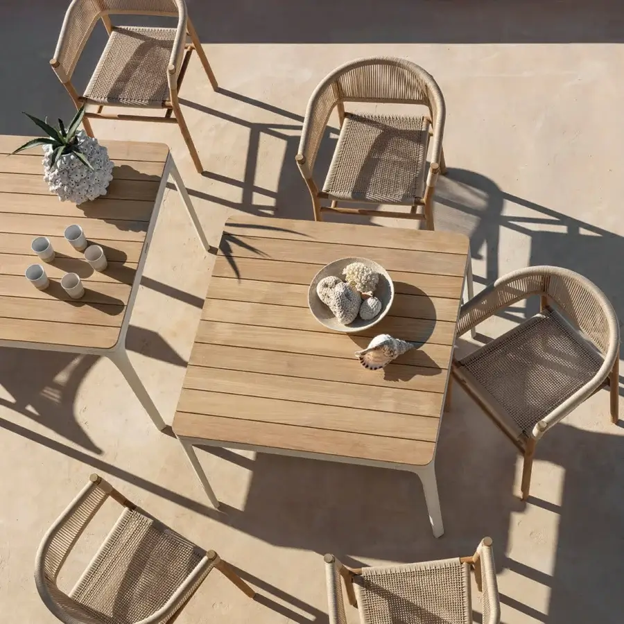 Sophisticated Ethimo Play table crafted in wood with a smooth satin finish and warm light brown tone