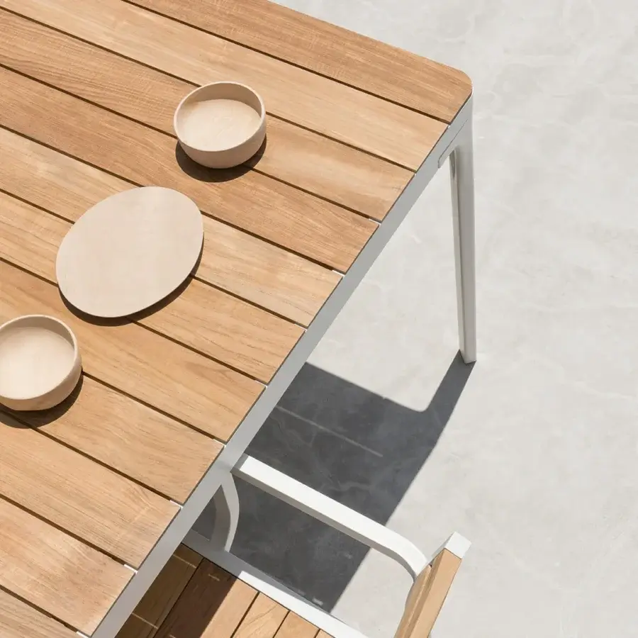 Distinguished Ethimo Play table with warm wood and smooth light gray metal crafted in contemporary Italian design