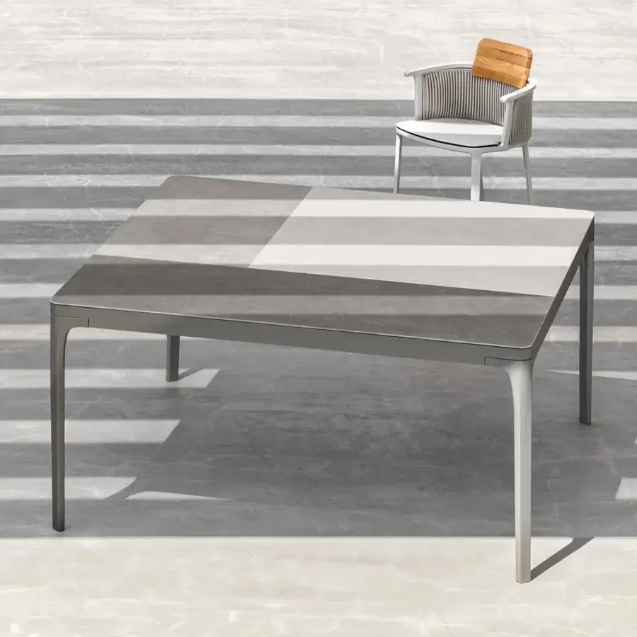 Superior Ethimo Play table with a gradient of neutral grays across durable stone composite and matte finish
