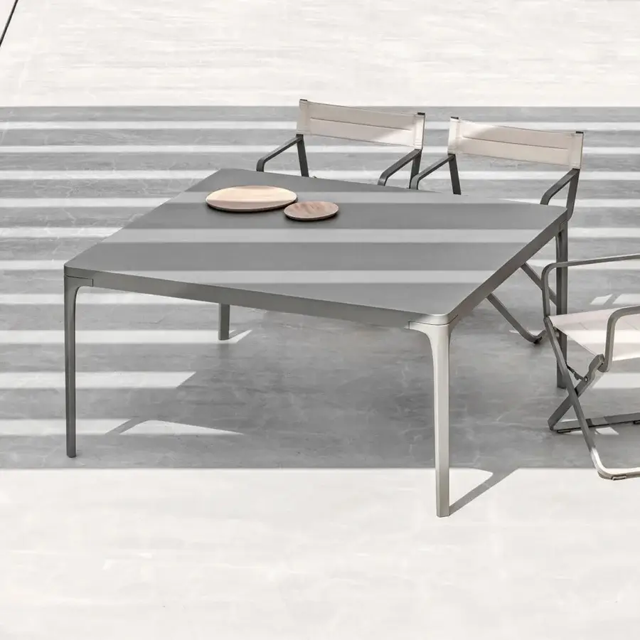 Harmonious Ethimo Play table crafted in muted gray metal with a smooth matte finish for contemporary outdoor use
