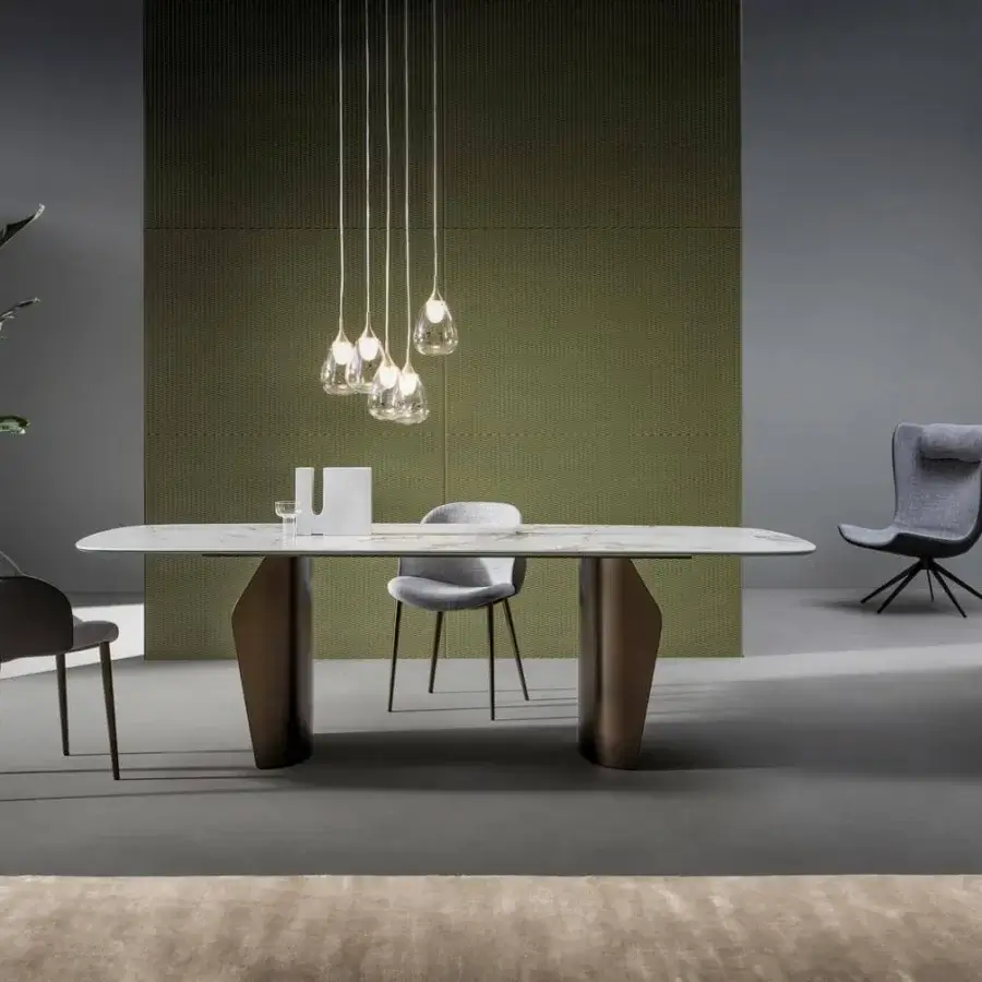 Harmonious Bonaldo Flame table with a light marble-like top displaying delicate veining and a sinuous dark metal double base
