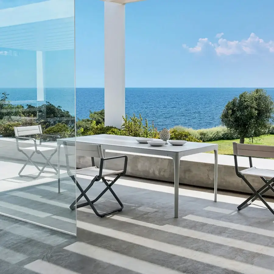 Exceptional Ethimo Play table crafted in light gray metal with a smooth matte finish for durable outdoor use