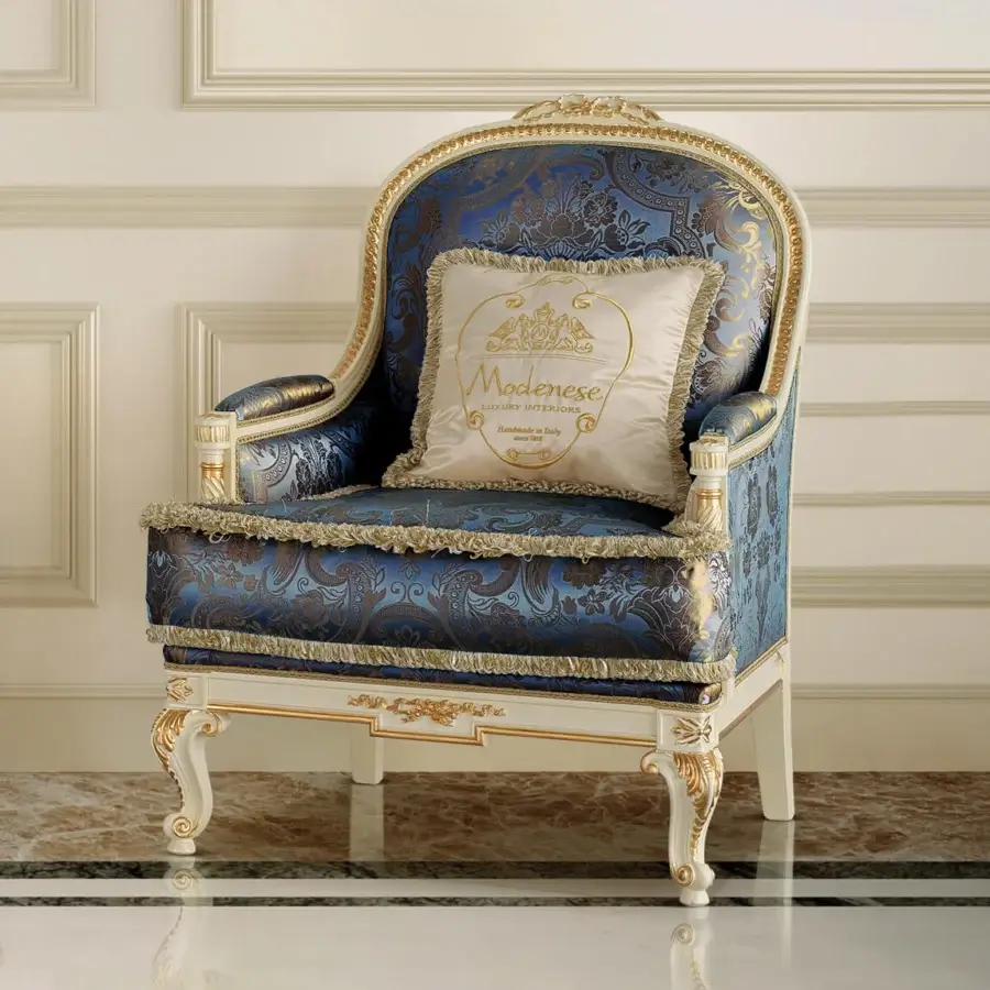 Distinguished Modenese Midnight Moon lounge chair with deep blue textile upholstery and opulent gold leaf accents