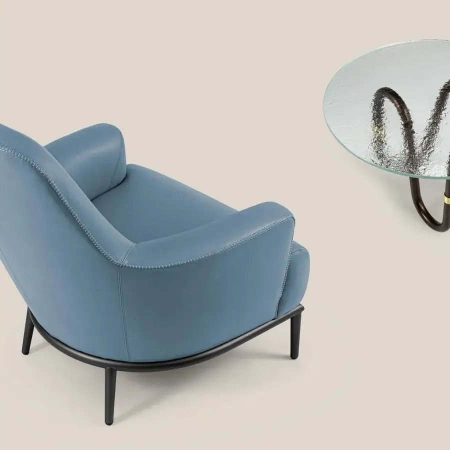 Elegant Borzalino Flow coffee table with transparent glass top and sinuous matte black tubular metal base crafted in Italy