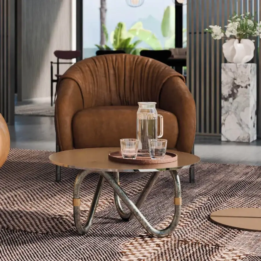 Distinguished Borzalino Flow coffee table with transparent glass tabletop and subtly textured, curved brushed metal base crafted in Italy